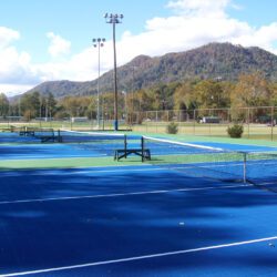 Floxcourt outdoor court with a small mountain in the background