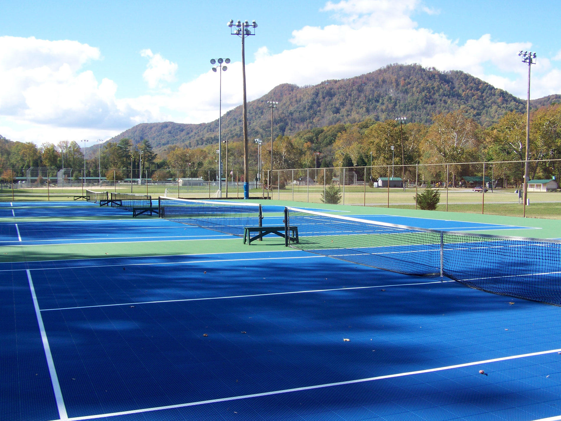Floxcourt outdoor court with a small mountain in the background