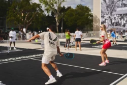 man and woman playing pickleball on the same team