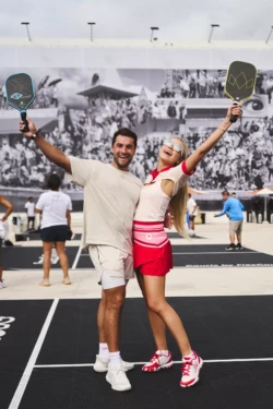 man and woman celebrating a pickleball win