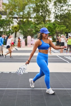 woman on a pickleball court in Jungle Plaza
