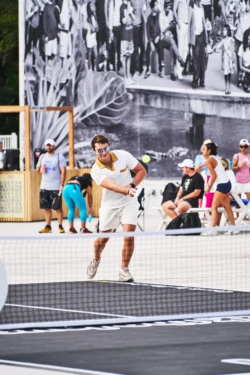 man returning a serve during a pickleball match