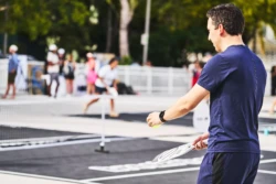 man getting ready to serve in a pickleball game